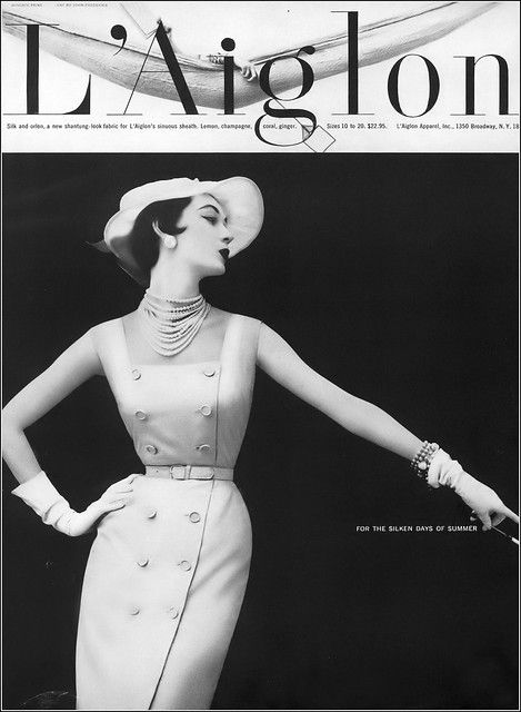 Dovima, silk and Orlon sheath by L’Aiglon, hat by John Frederics, photo by Wingate Paine, Vogue, May 1, 1953